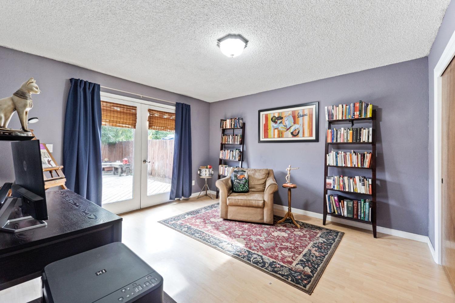 918 East Griffith Way Fresno, CA 93704 - Photo 7 of 21 a living room with furniture rug and window