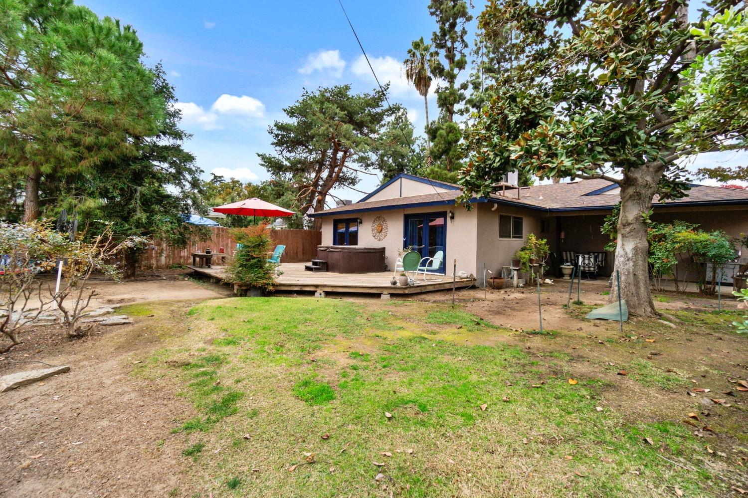 918 East Griffith Way Fresno, CA 93704 - Photo 10 of 21 a view of a house with pool and chairs
