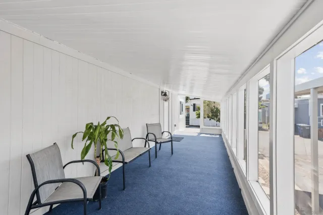 a view of a hallway with furniture and toys