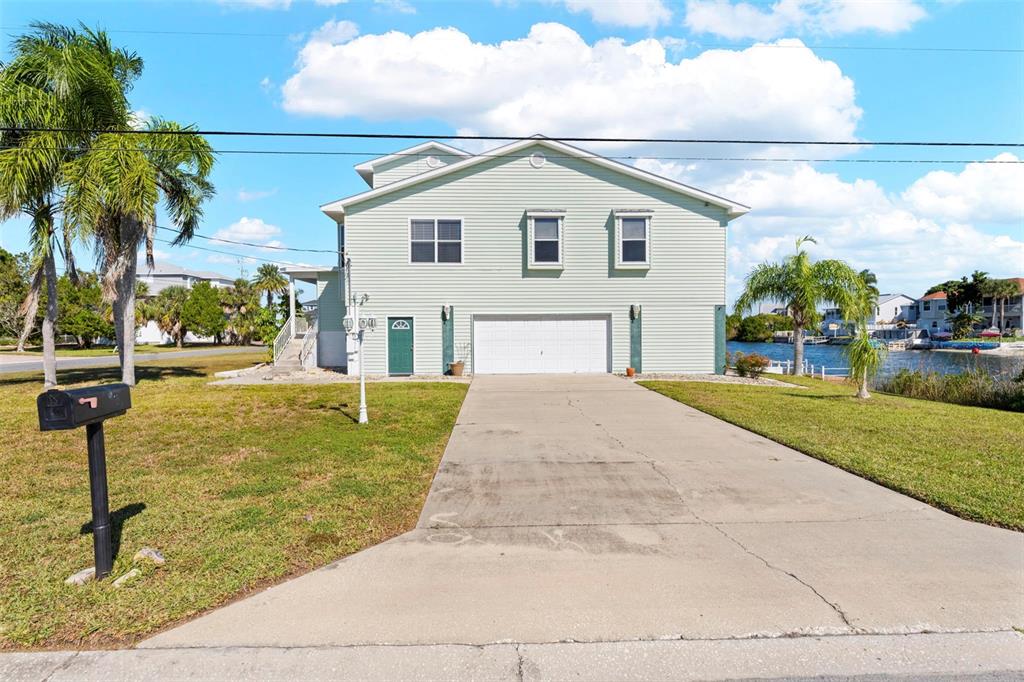 Undisclosed Address Hernando Beach, FL 34607 - Photo 11 of 90 a view of house with outdoor space