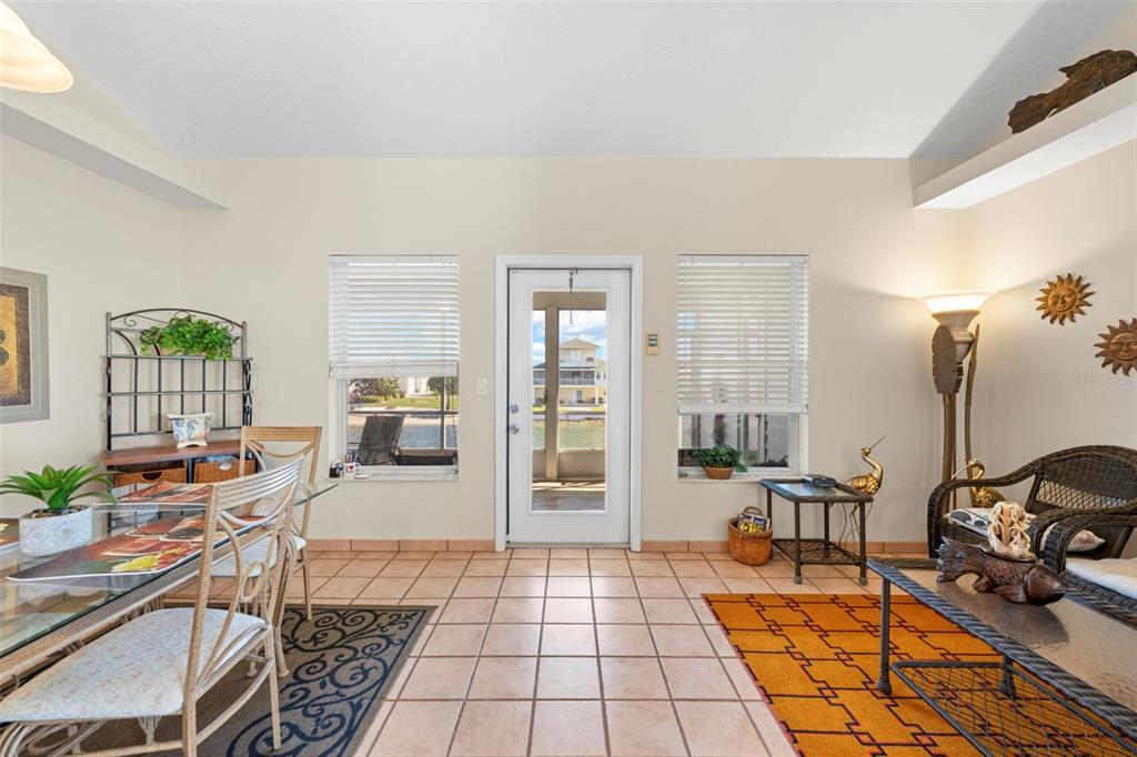 Undisclosed Address Hernando Beach, FL 34607 - Photo 21 of 90 a hallway with a view of kitchen and dining room view