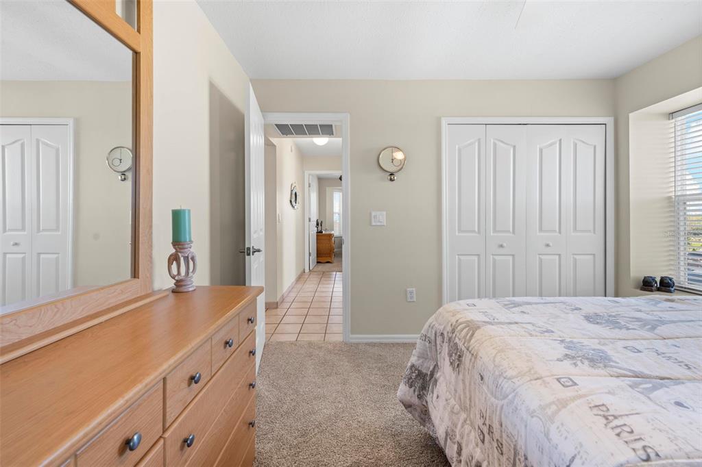 Undisclosed Address Hernando Beach, FL 34607 - Photo 59 of 90 a bedroom with a sink and a mirror