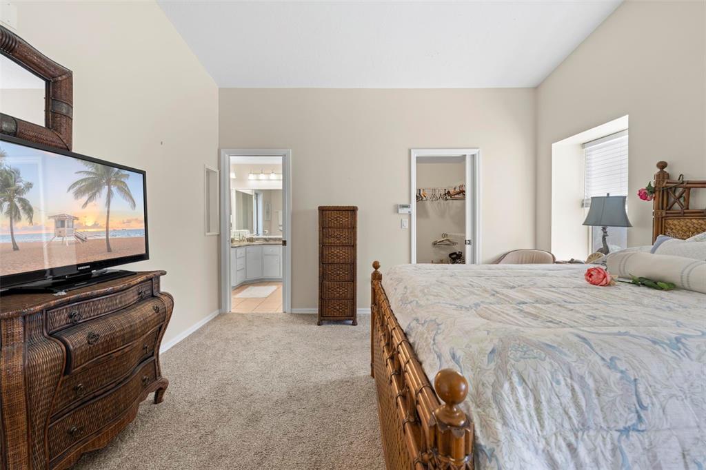 Undisclosed Address Hernando Beach, FL 34607 - Photo 63 of 90 a bedroom with a bed and a flat screen tv