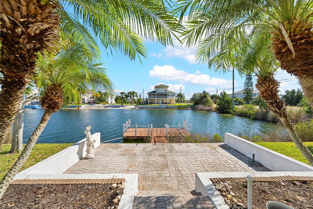 Undisclosed Address Hernando Beach, FL 34607 - Photo 87 of 90 a view of a lake with houses