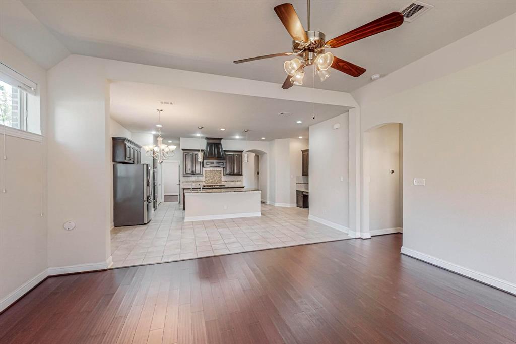 6723 Capistrano Street Irving, TX 75039 - Photo 1 of 40 a view of a kitchen with a sink and a refrigerator