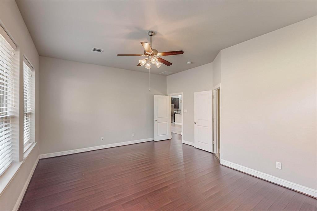 6723 Capistrano Street Irving, TX 75039 - Photo 18 of 40 wooden floor in an empty room with a window
