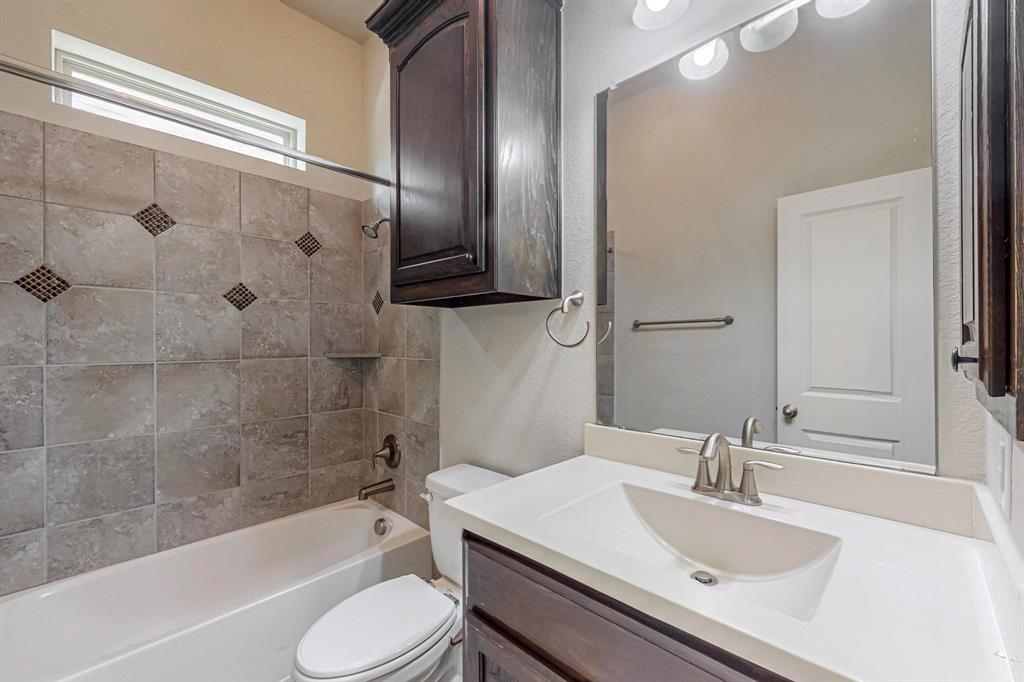 6723 Capistrano Street Irving, TX 75039 - Photo 31 of 40 a bathroom with a sink toilet tub and shower