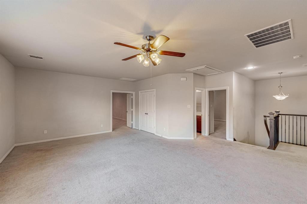 6723 Capistrano Street Irving, TX 75039 - Photo 37 of 40 a view of a big room with a ceiling fan and a window