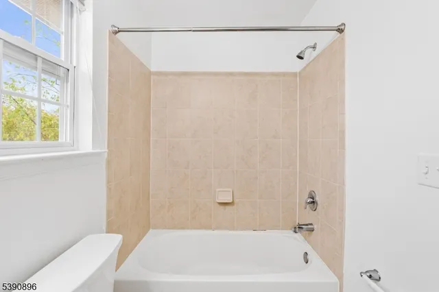 a bathroom with a white bath tub