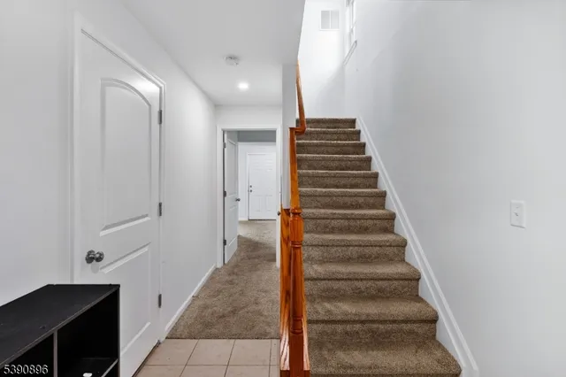 a view of a hallway with front door
