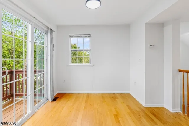 a view of empty room with windows