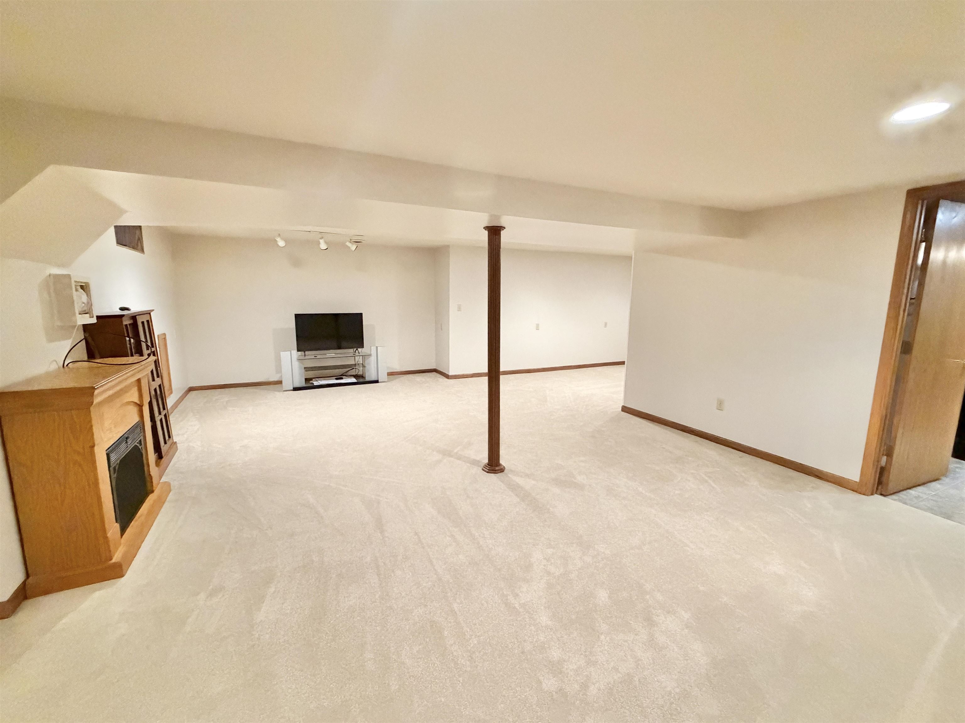 305 West Pershing Street Stillman Valley, IL 61084 - Photo 20 of 37 a view of a kitchen with a sink stove and a refrigerator