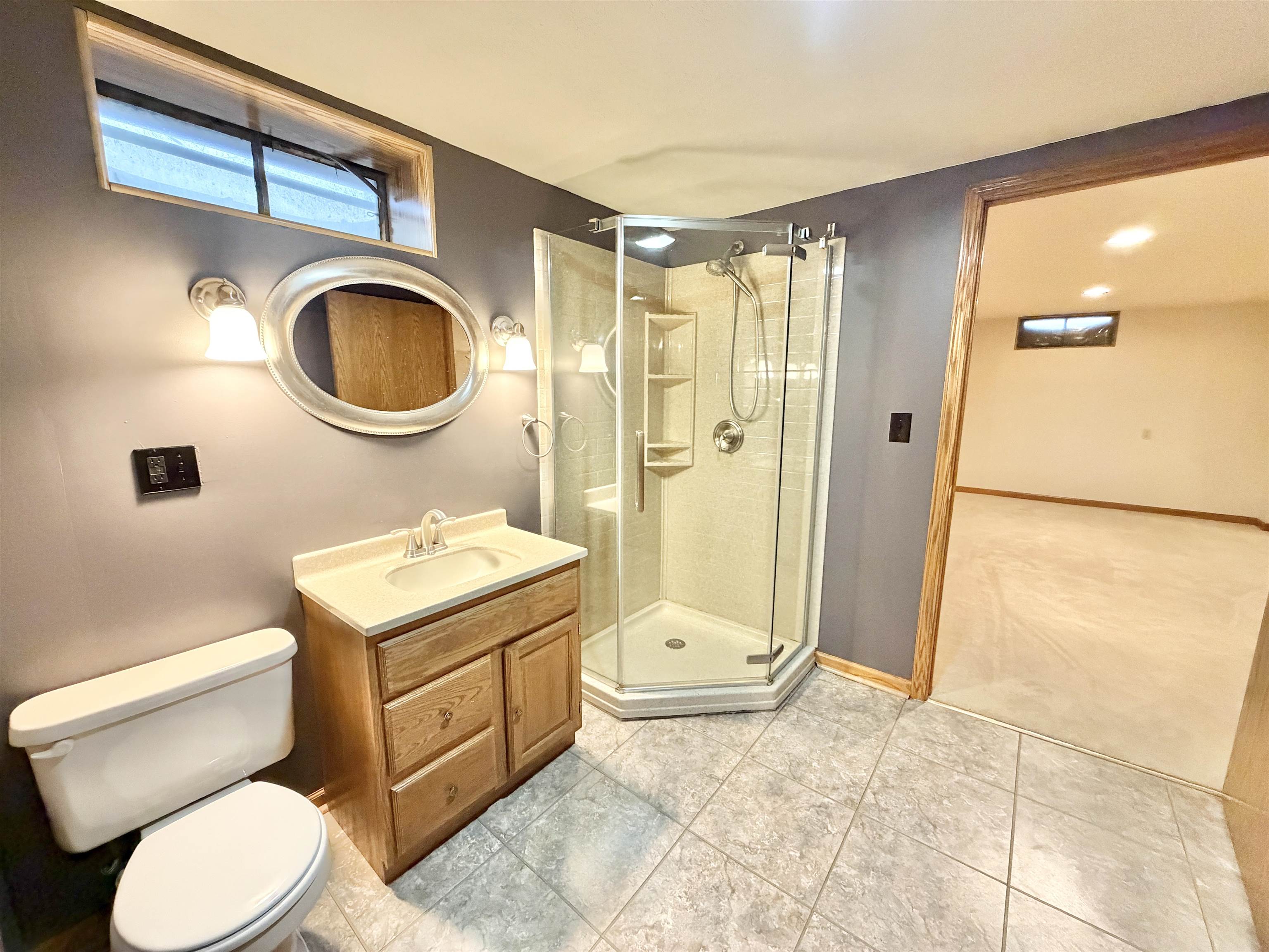 305 West Pershing Street Stillman Valley, IL 61084 - Photo 26 of 37 a bathroom with a toilet a sink and a shower