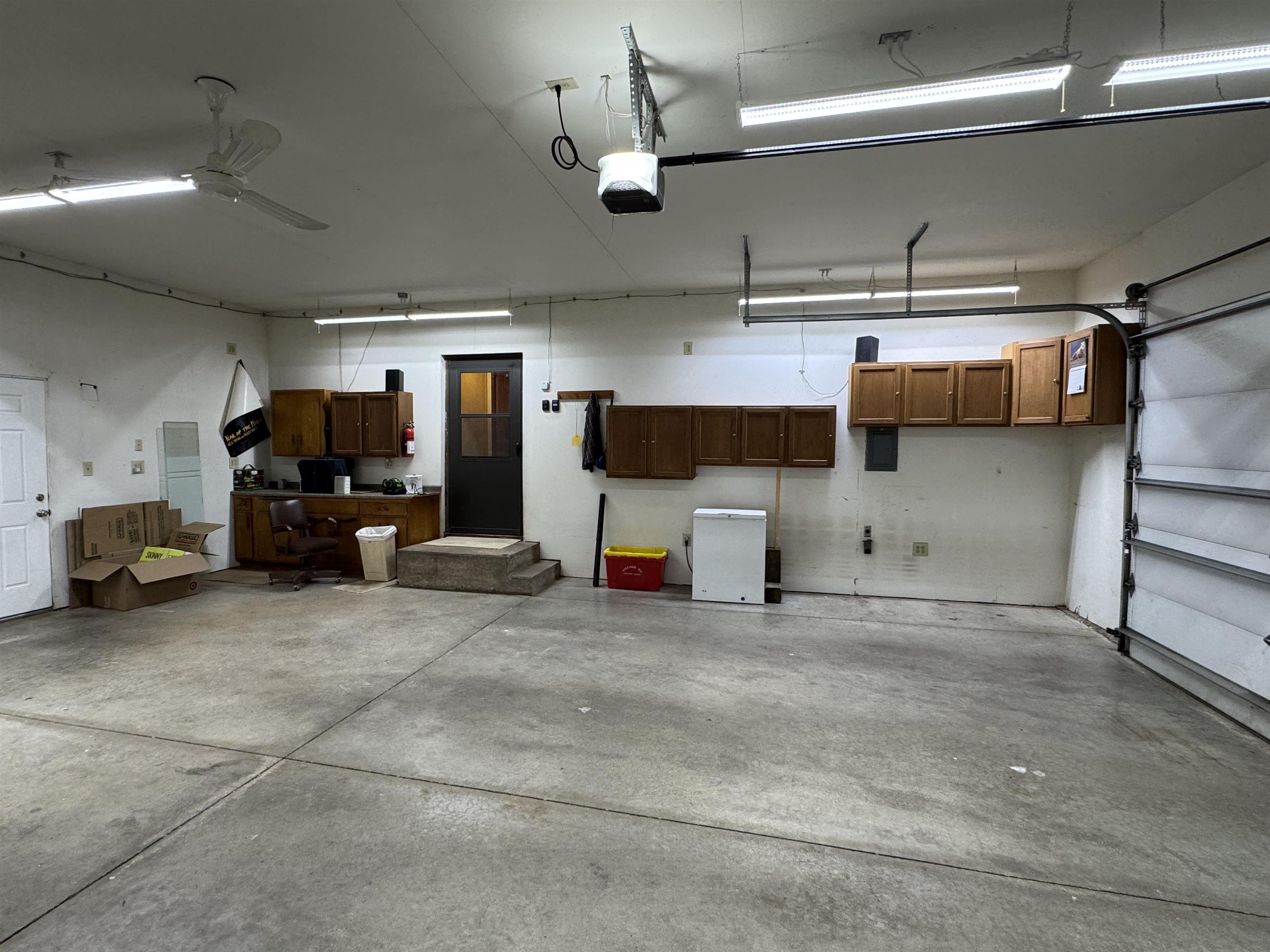 305 West Pershing Street Stillman Valley, IL 61084 - Photo 29 of 37 a view of parking garage with cars