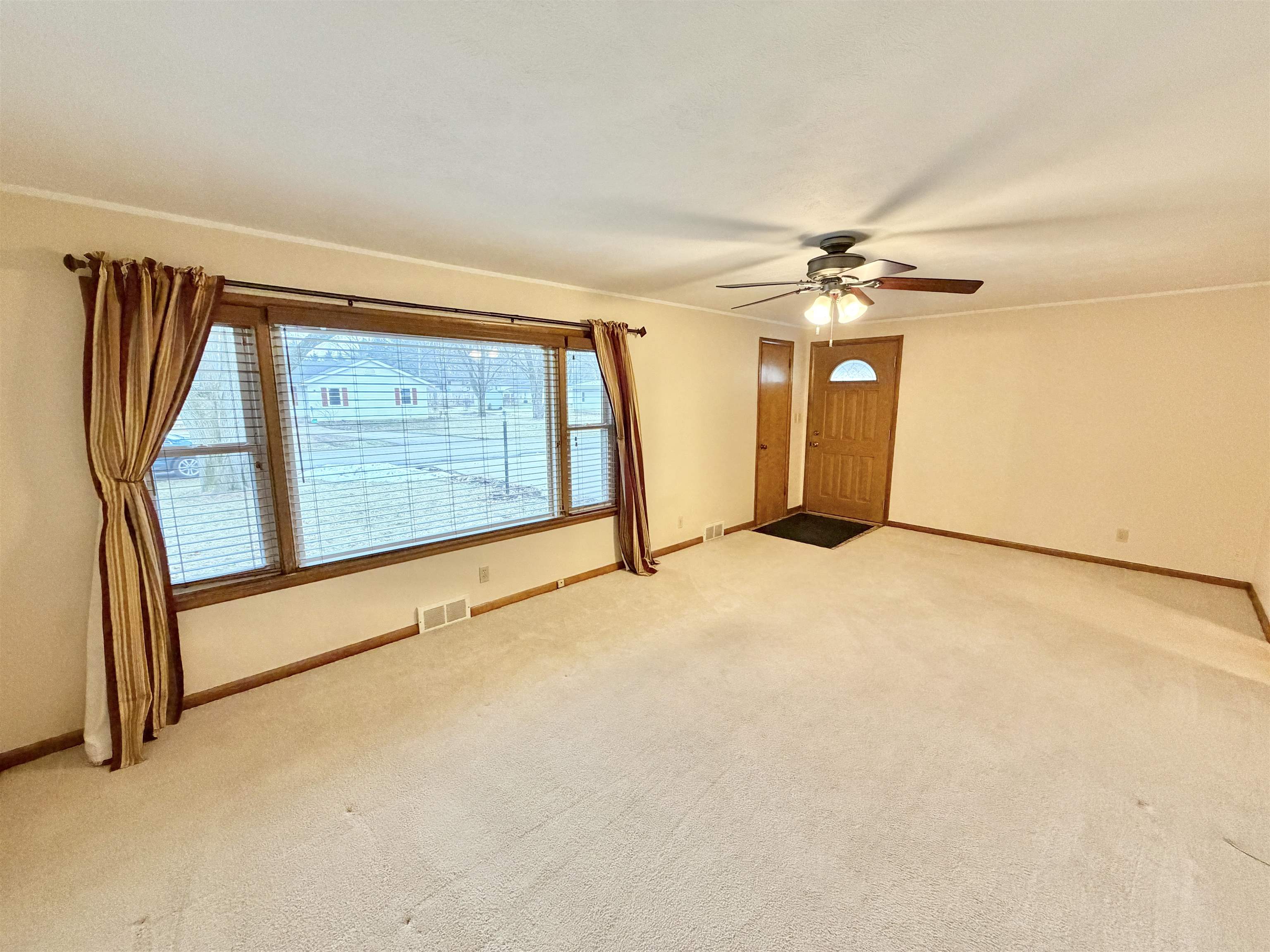 305 West Pershing Street Stillman Valley, IL 61084 - Photo 3 of 37 an empty room with windows