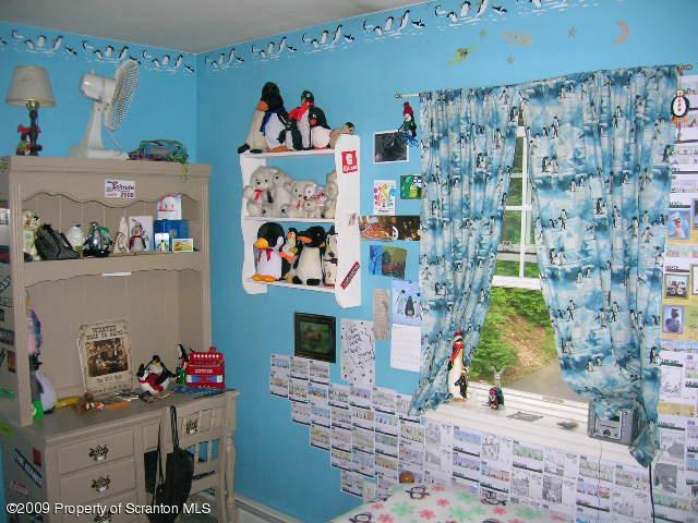 284 Long Mountain Road Effort, PA 18330 - Photo 17 of 20 a bed room with a bed and a couch