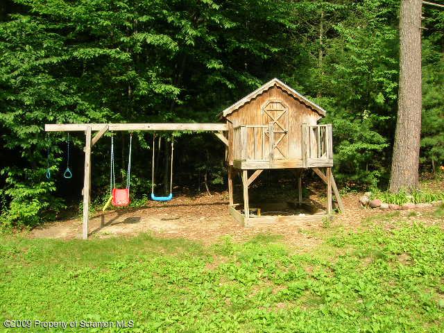 284 Long Mountain Road Effort, PA 18330 - Photo 4 of 20 a view of a house with backyard and a tree