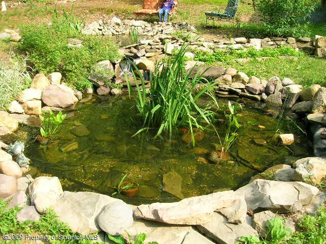 284 Long Mountain Road Effort, PA 18330 - Photo 5 of 20 a backyard of a house with yard and outdoor seating