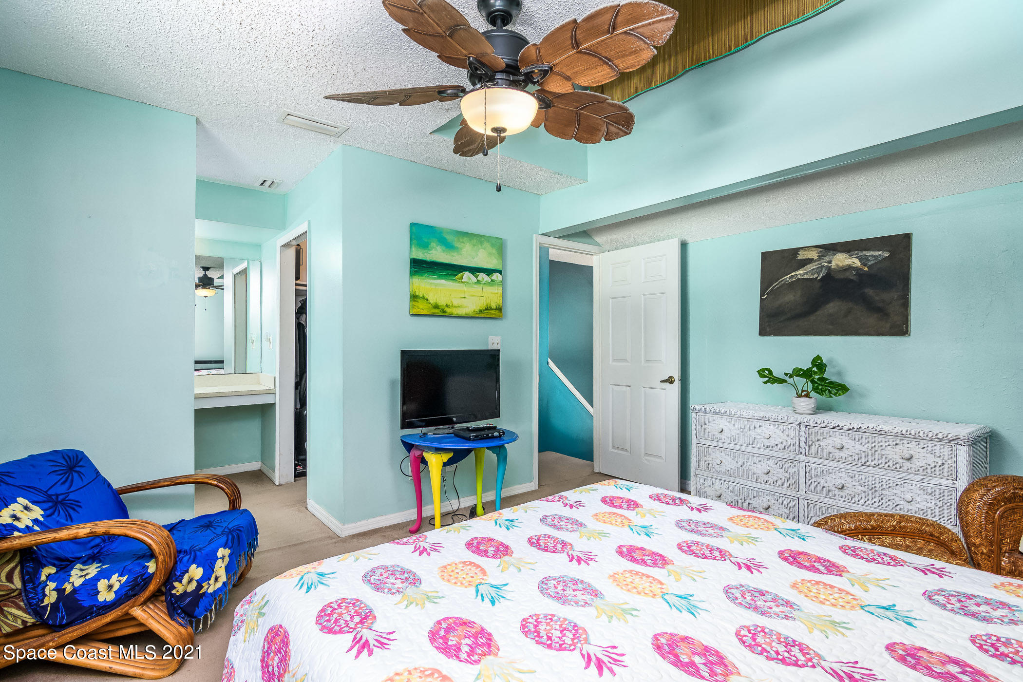 1100 Gary Hunt Road, Unit 1D Cocoa, FL 32926 - Photo 22 of 24 a bedroom with a bed and a flat screen tv