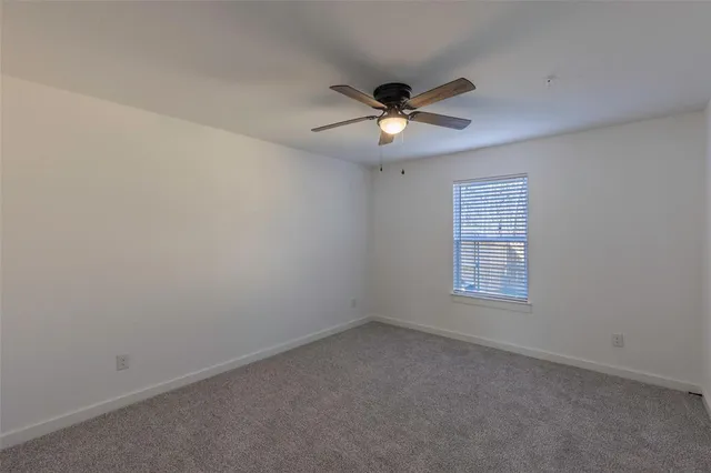 a view of a bathroom with a bathtub a sink and mirror