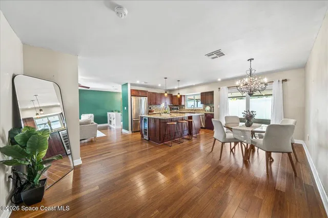 a bedroom with a bed and ceiling fan