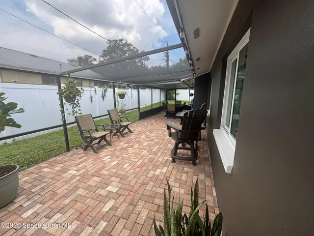 an aerial view of a house with a garden