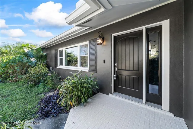 a living room with furniture dining table wooden floor and a dining table