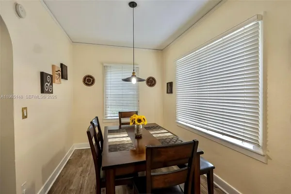 a view of a dining room with furniture and window