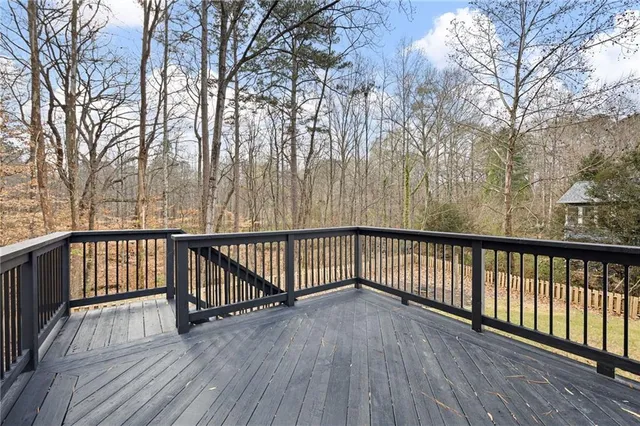 a view of balcony with wooden floor