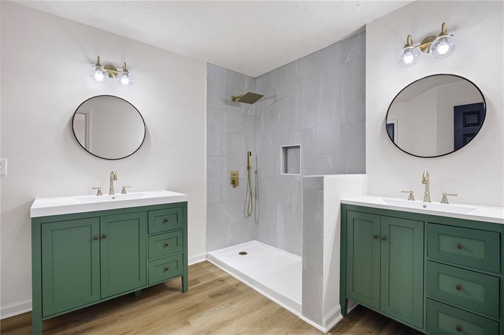 1029 Regency Drive Acworth, GA 30102 - Photo 25 of 36 a bathroom with 2 sink and a mirror