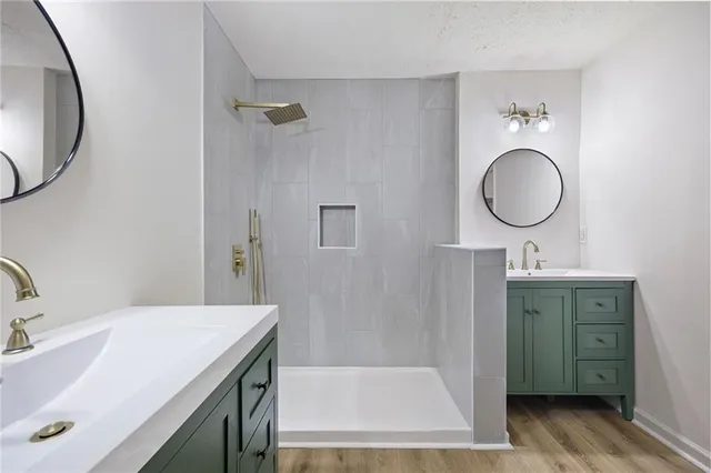 a bathroom with a sink a toilet and a mirror