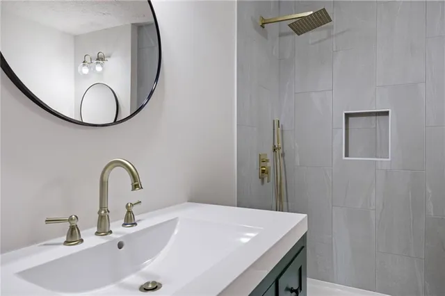 a bathroom with a sink and a mirror
