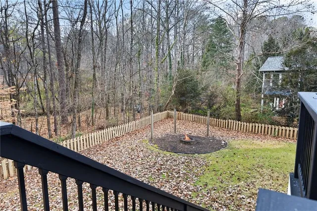 a vase of flowers sitting on top of a wooden floor