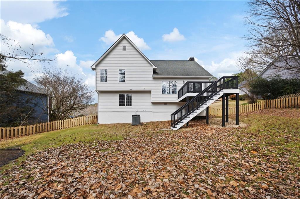1029 Regency Drive Acworth, GA 30102 - Photo 33 of 36 a front view of a house with a yard