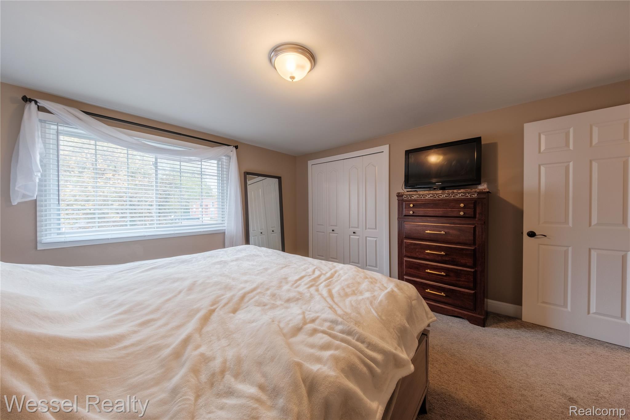 67976 Van Dyke Road, Unit 8 Washington, MI 48095 - Photo 15 of 27 Bedroom with light colored carpet