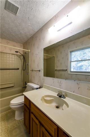 5960 Natchez Trace Road Franklin, TN 37064 - Photo 7 of 18 a bathroom with a sink toilet double vanity and shower