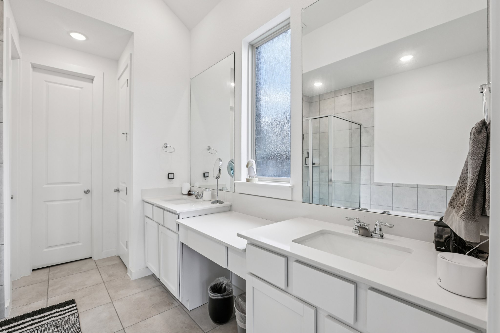 930 Nautical Loop Kyle, TX 78640 - Photo 11 of 25 Double vanity sinks plus built in vanity table in the middle and love the window for great natural light