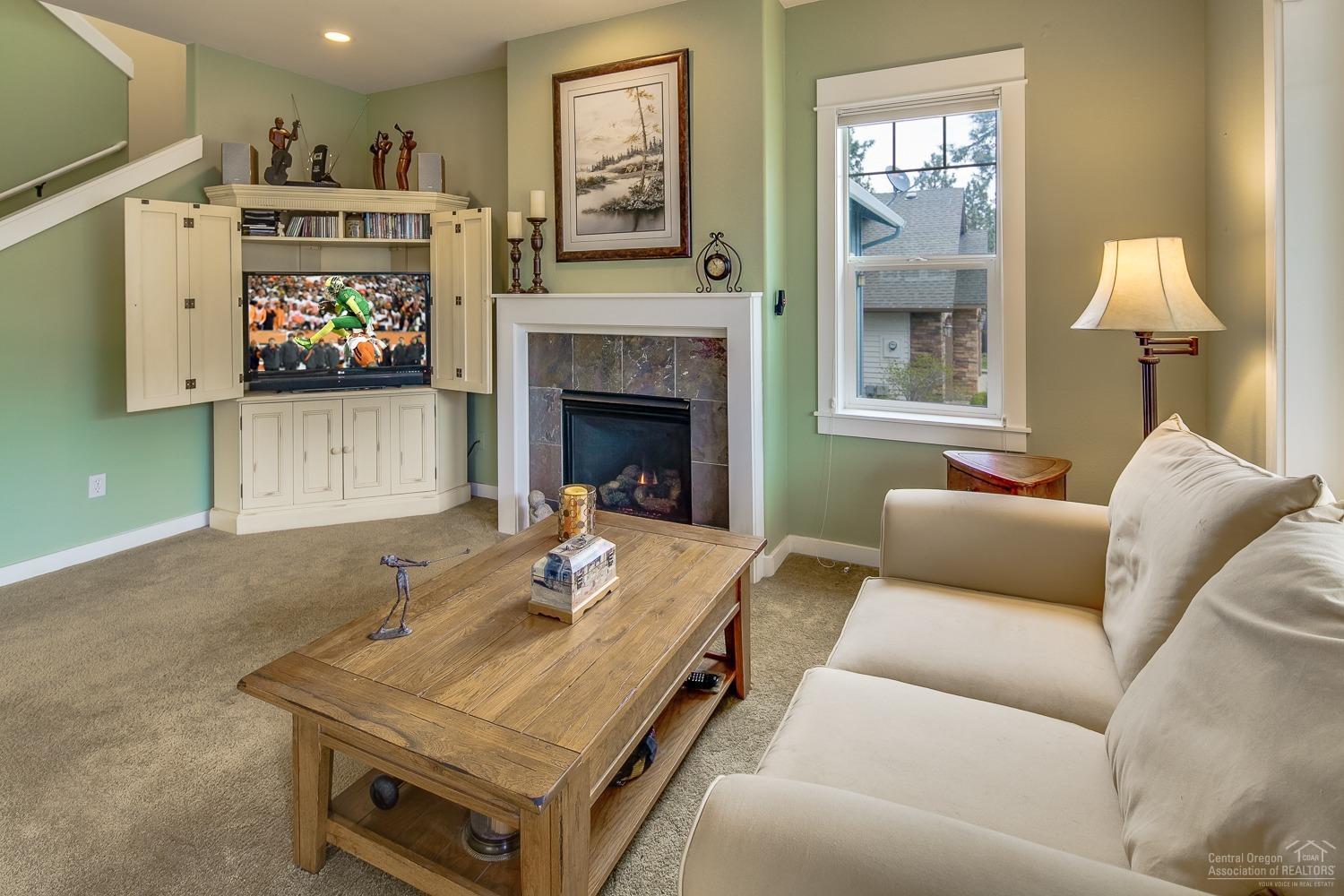 61209 Ridgewater Loop Bend, OR 97702 - Photo 6 of 25 Open great room with cozy gas fireplace.