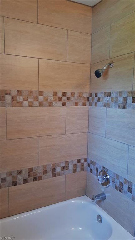 8131 East Harrell Road Oak Ridge, NC 27310 - Photo 11 of 13 Close up of the beautiful tile surround!