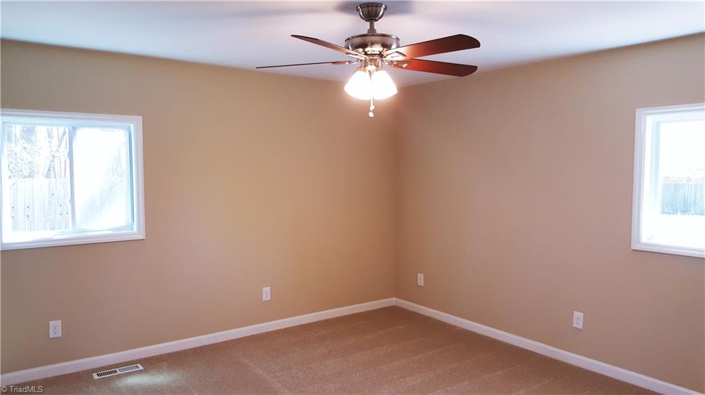 8131 East Harrell Road Oak Ridge, NC 27310 - Photo 7 of 13 Master Bedroom Suite with new carpet, walk-in close, and 2 windows!