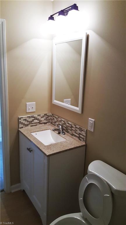 8131 East Harrell Road Oak Ridge, NC 27310 - Photo 9 of 13 All new fixtures & a tile backsplash!
