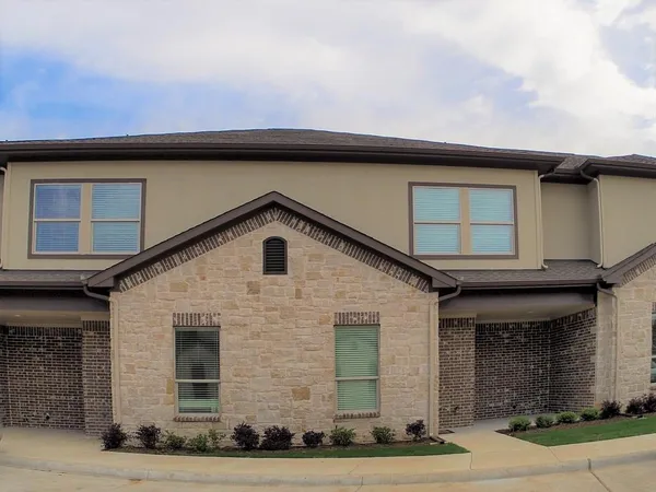 a front view of a house with garage