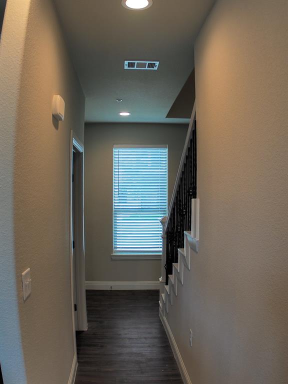1601 Riney Road Denton, TX 76207 - Photo 8 of 18 an empty room with wooden floor and windows