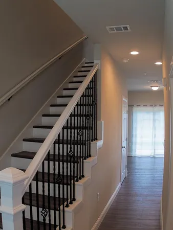 a view of entryway with wooden floor