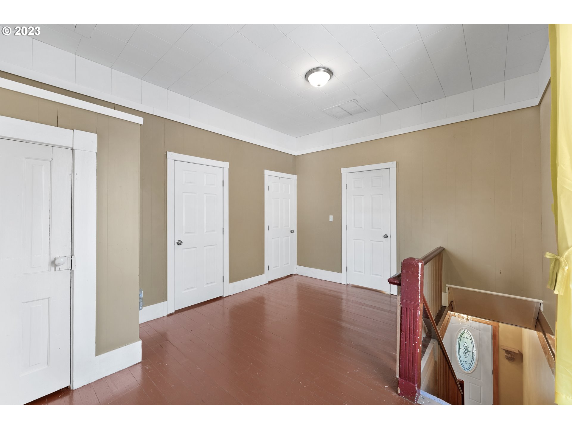313 Centre Street La Conner, WA 98257 - Photo 16 of 29 a view of an empty room with wooden floor
