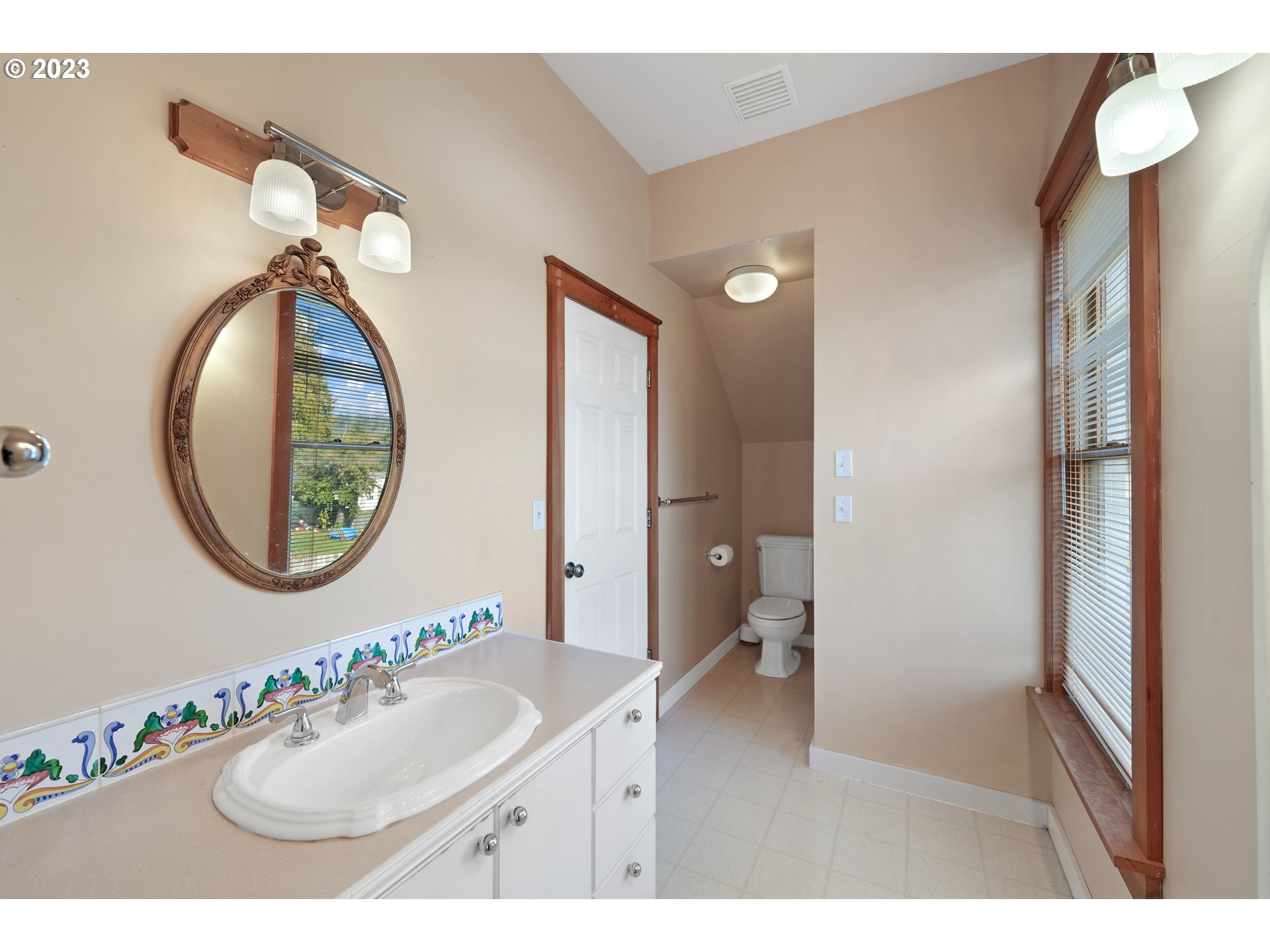 313 Centre Street La Conner, WA 98257 - Photo 20 of 29 a bathroom with a sink and a mirror