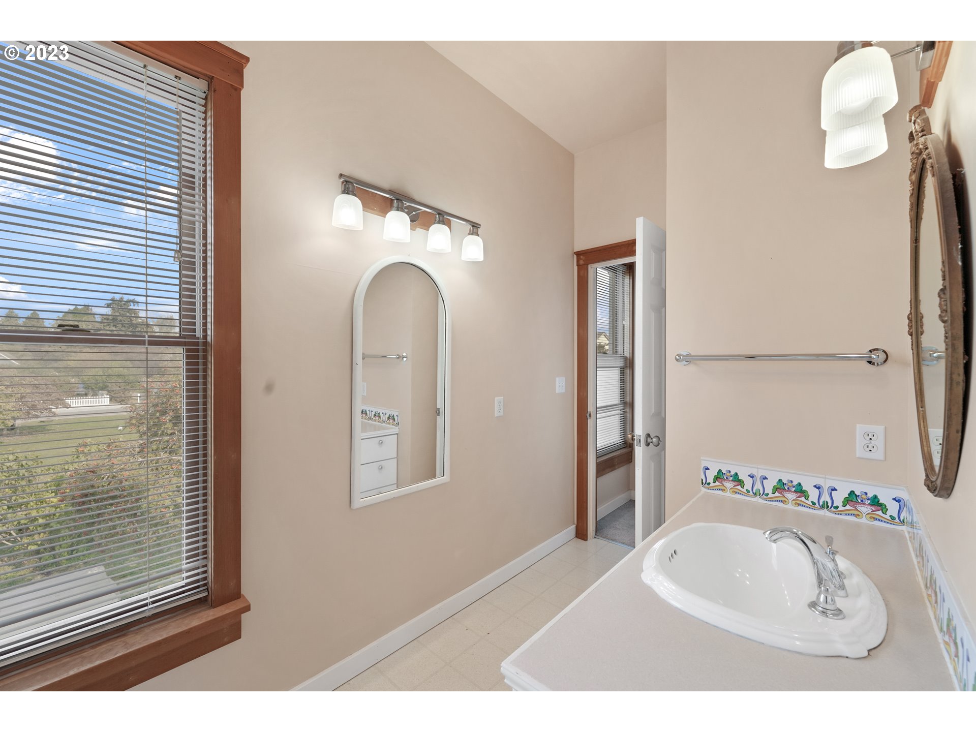 313 Centre Street La Conner, WA 98257 - Photo 21 of 29 a bathroom with a sink mirror and shower