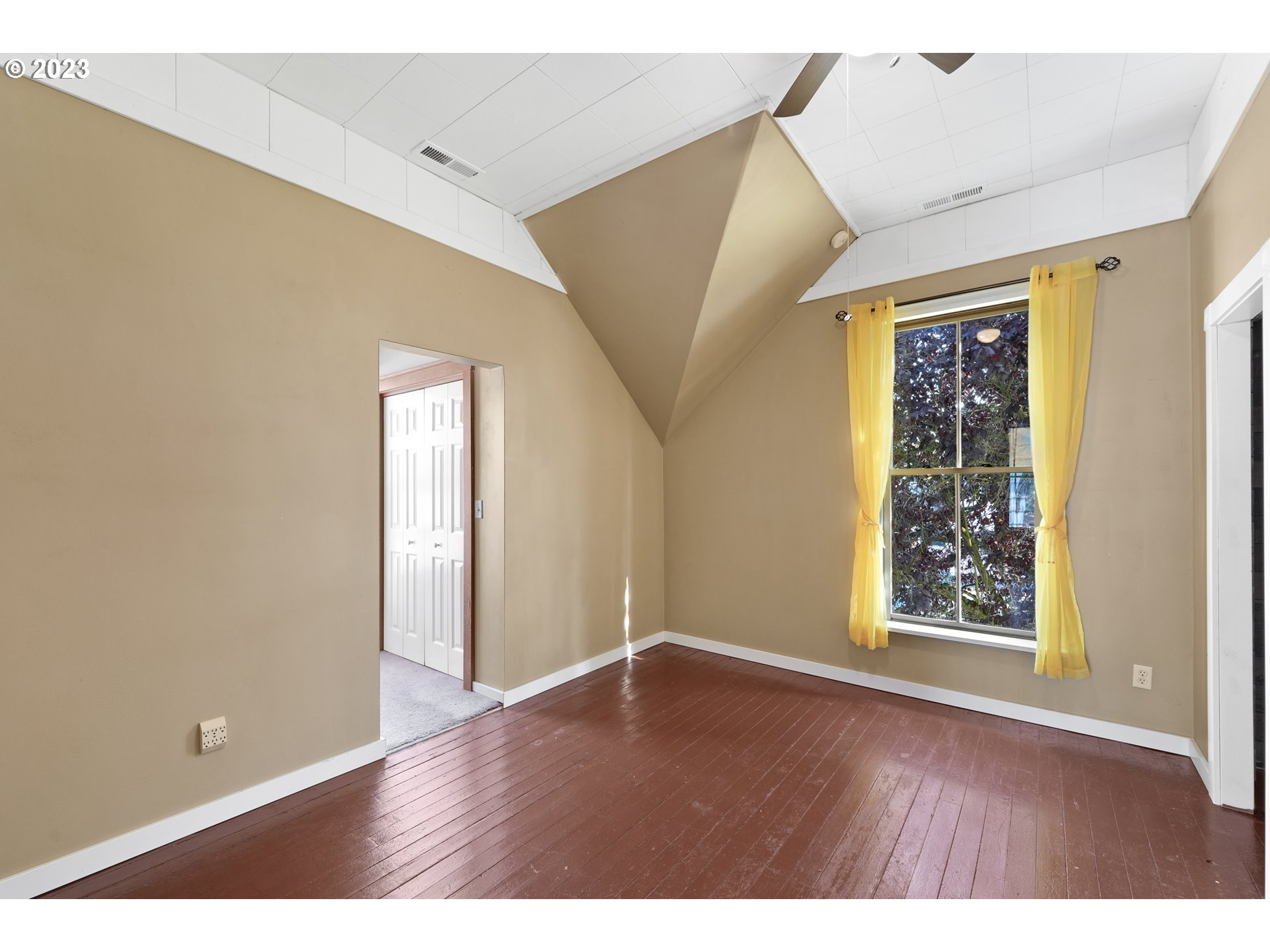 313 Centre Street La Conner, WA 98257 - Photo 22 of 29 a view of an empty room with window and wooden floor