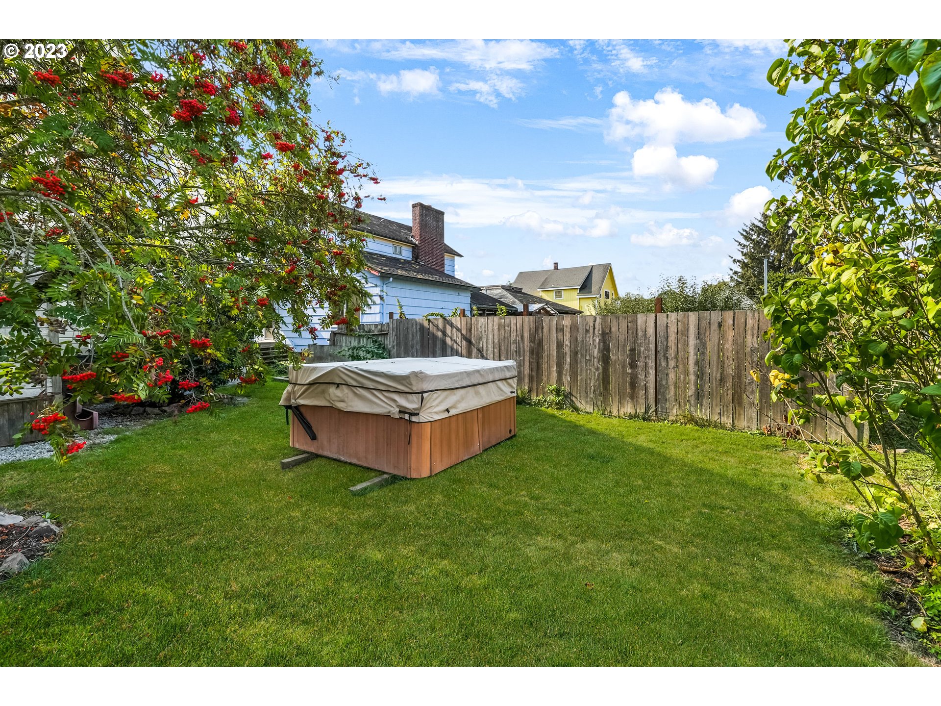 313 Centre Street La Conner, WA 98257 - Photo 26 of 29 a view of a house with a backyard and a patio