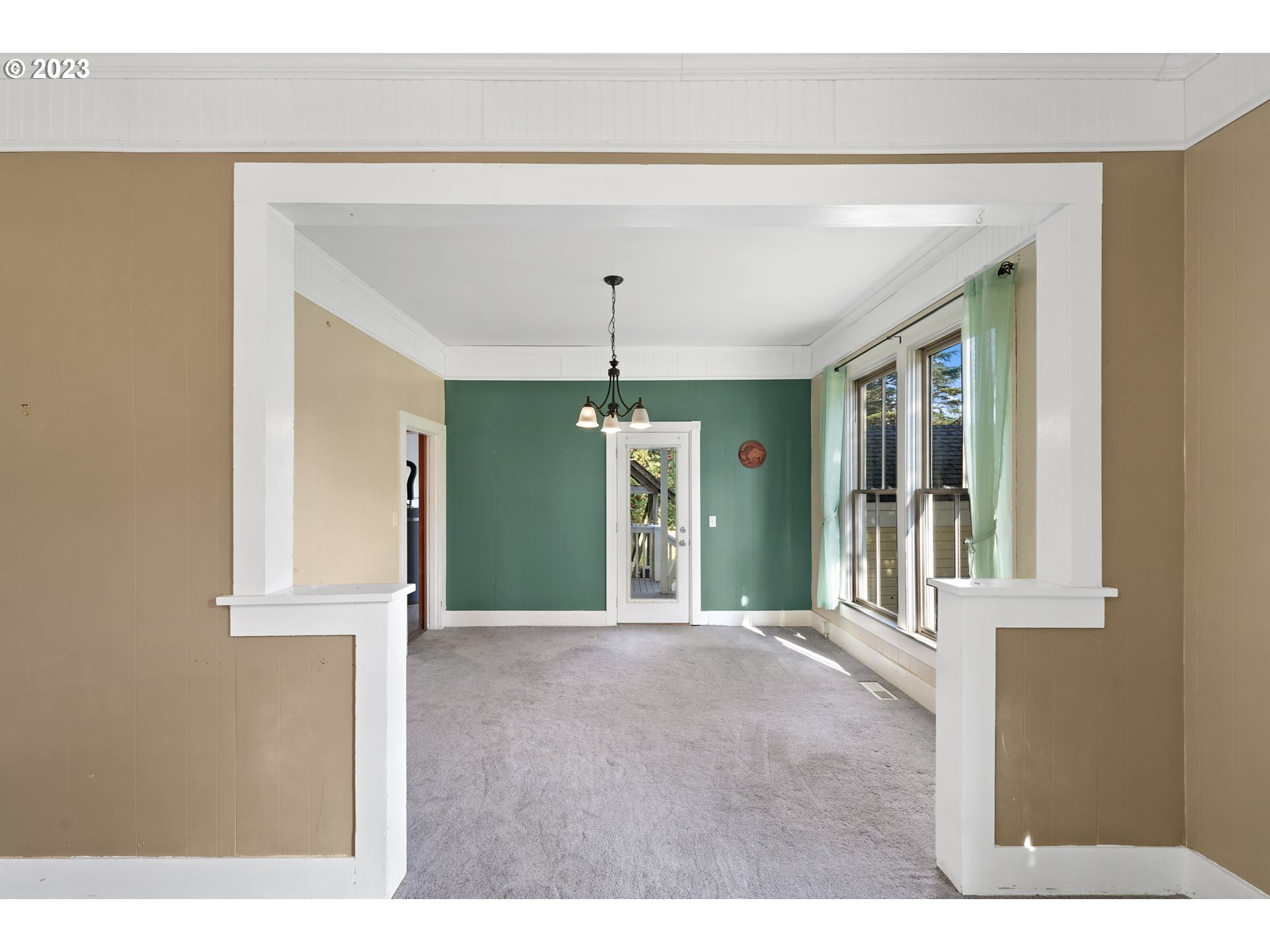 313 Centre Street La Conner, WA 98257 - Photo 7 of 29 a view of an empty room with window and kitchen view